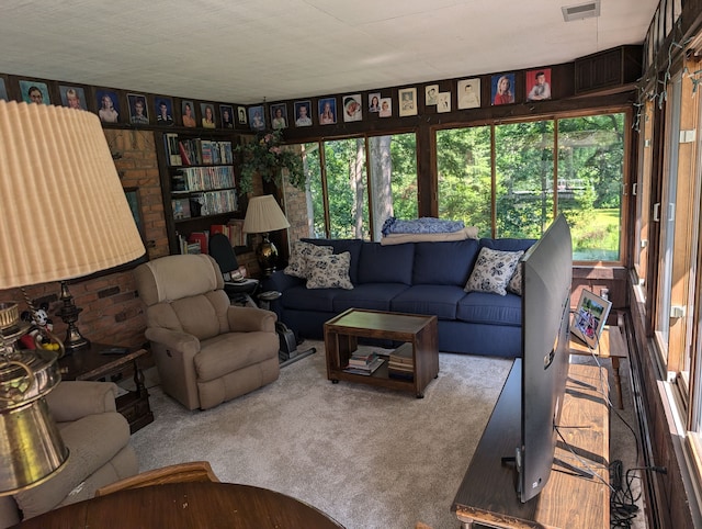 living room with carpet floors and a textured ceiling