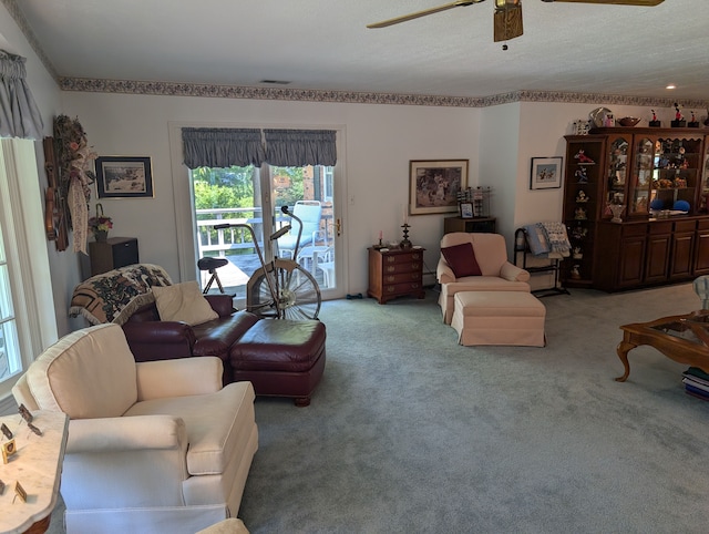 living room with light colored carpet and ceiling fan