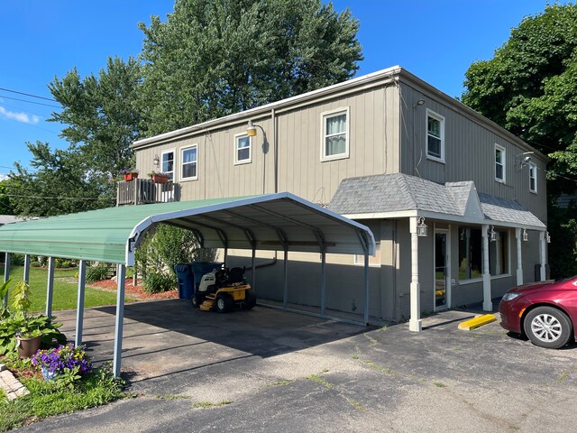 11424 W Corunna Rd, Lennon, MI 48449 - view of parking / parking lot featuring a detached carport and driveway