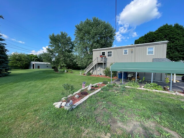 11424 W Corunna Rd, Lennon, MI 48449 - view of grassy yard featuring stairs and a wooden deck