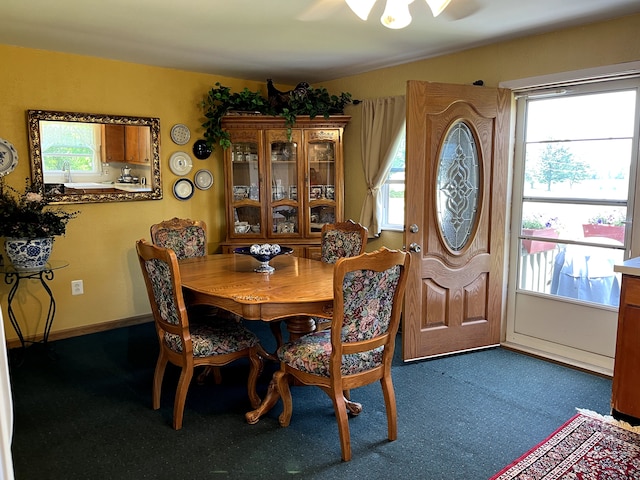 11424 W Corunna Rd, Lennon, MI 48449 - carpeted dining space with healthy amount of natural light and a ceiling fan