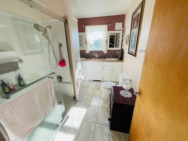 11424 W Corunna Rd, Lennon, MI 48449 - bathroom featuring a stall shower, vanity, tasteful backsplash, tile patterned floors, and toilet