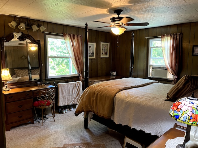 11424 W Corunna Rd, Lennon, MI 48449 - bedroom featuring carpet, wooden walls, cooling unit, and a ceiling fan