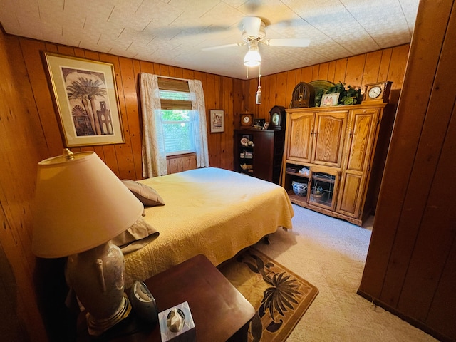 11424 W Corunna Rd, Lennon, MI 48449 - bedroom featuring light carpet, wood walls, and ceiling fan