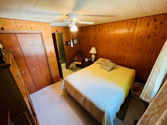 11424 W Corunna Rd, Lennon, MI 48449 - carpeted bedroom featuring wood walls and a ceiling fan