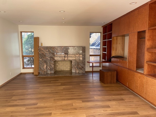 unfurnished living room featuring light hardwood / wood-style floors