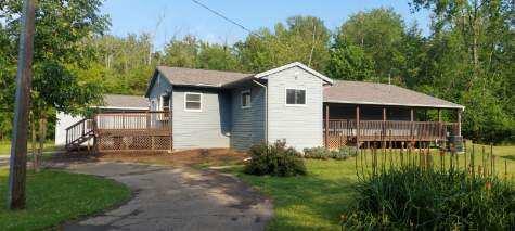 exterior space with a yard and a wooden deck