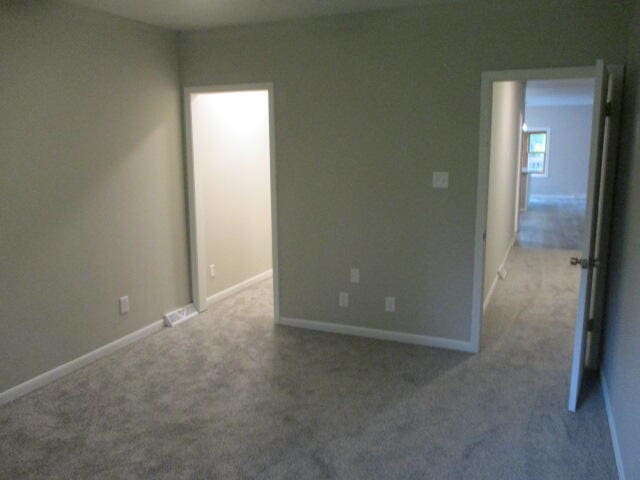 empty room featuring light colored carpet