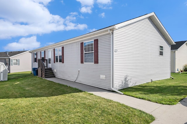 view of home's exterior featuring a yard