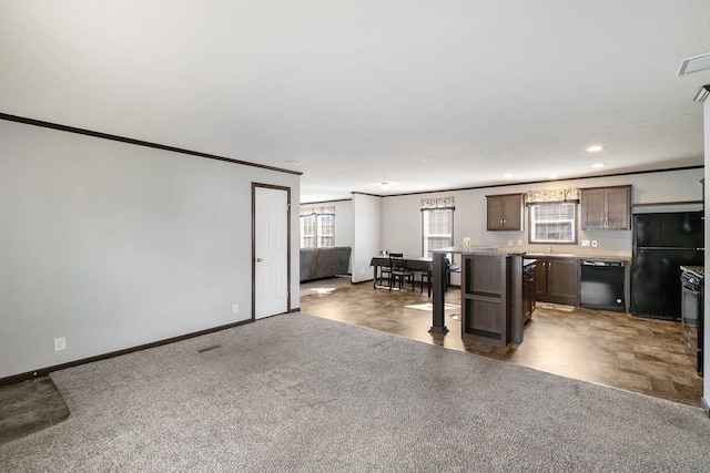 unfurnished living room with a textured ceiling, carpet floors, and crown molding