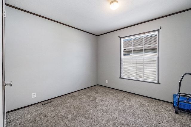 carpeted empty room with ornamental molding