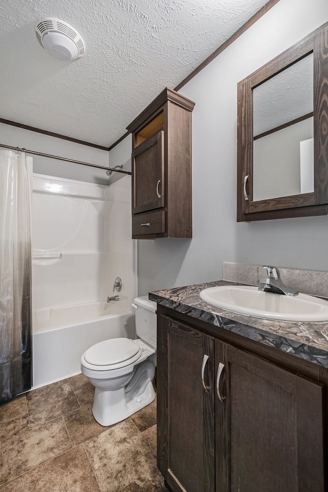 full bathroom featuring vanity, toilet, a textured ceiling, and shower / tub combo