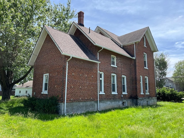 view of property exterior with a yard