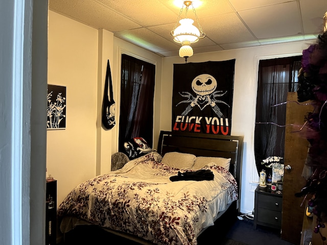 bedroom with a paneled ceiling