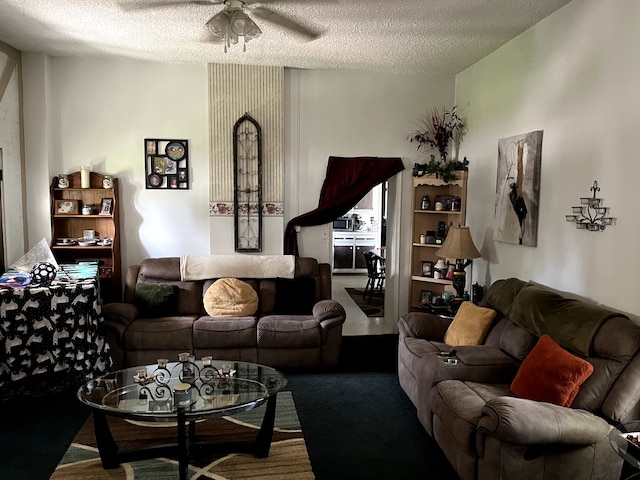 carpeted living room with ceiling fan and a textured ceiling