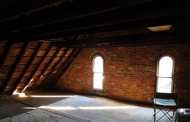 unfinished attic featuring a wealth of natural light