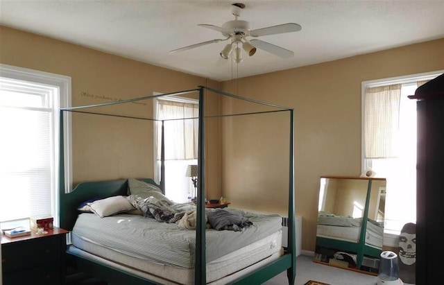 carpeted bedroom featuring ceiling fan