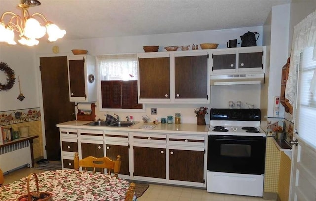 kitchen featuring dark brown cabinets, sink, electric stove, an inviting chandelier, and radiator heating unit