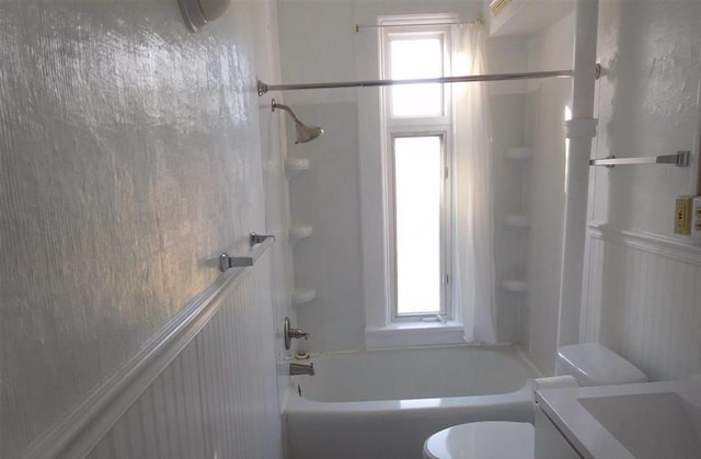 bathroom with vanity, a healthy amount of sunlight, and toilet