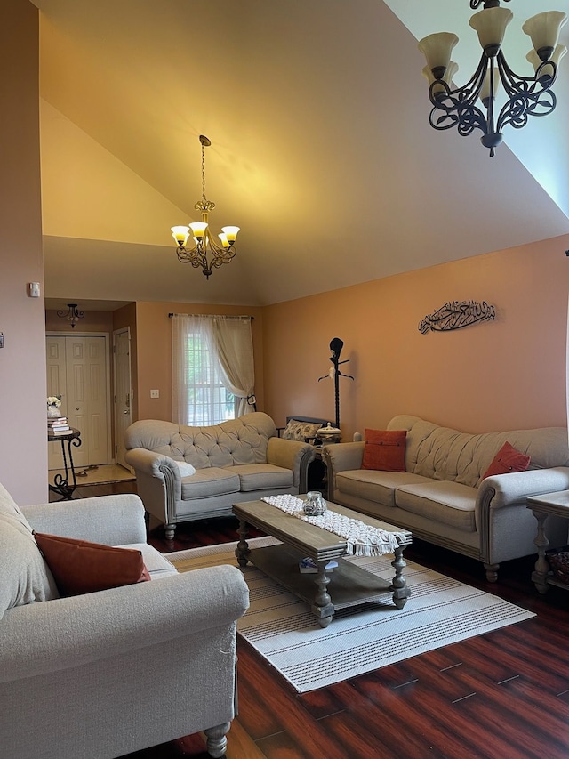 living room with hardwood / wood-style flooring, high vaulted ceiling, and an inviting chandelier