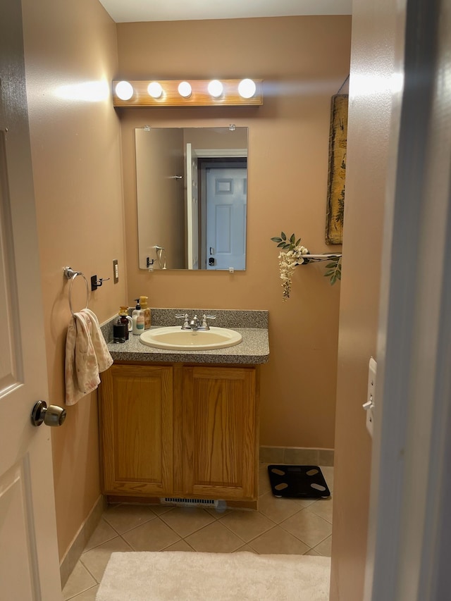 bathroom featuring tile patterned floors and vanity