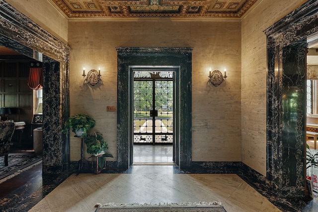 foyer entrance with french doors and ornamental molding