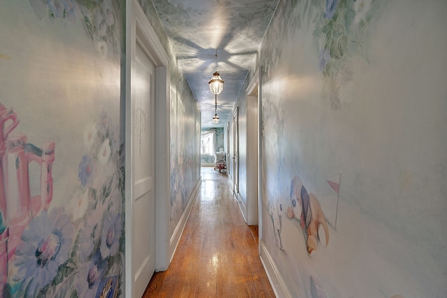 hallway with hardwood / wood-style floors