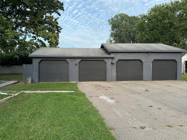 garage featuring a lawn