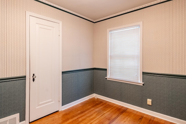 empty room featuring hardwood / wood-style flooring