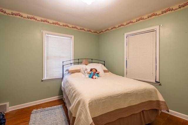 bedroom featuring wood-type flooring