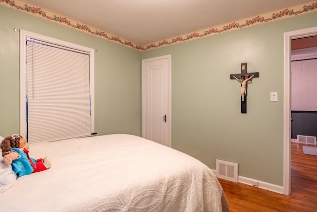 bedroom featuring hardwood / wood-style flooring