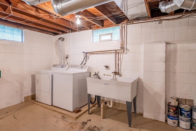 washroom featuring separate washer and dryer and sink