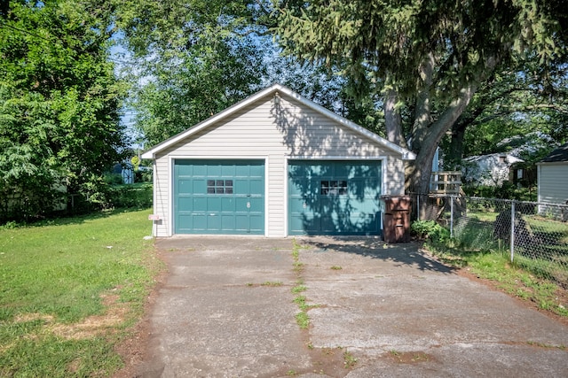 garage with a yard