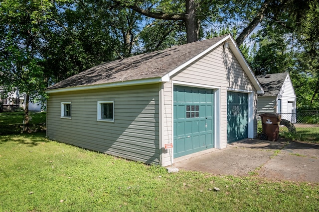 garage featuring a yard