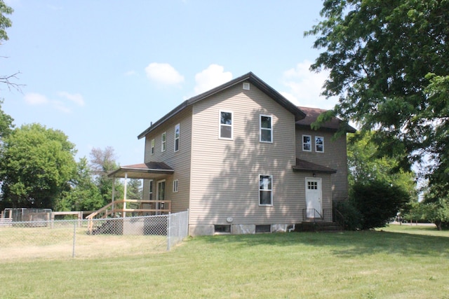 back of house with a yard