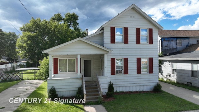 bungalow-style house featuring a front yard