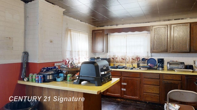 kitchen featuring kitchen peninsula and sink