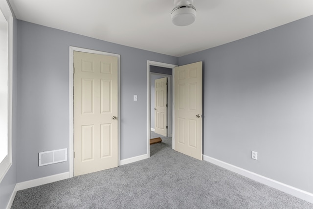 unfurnished bedroom featuring carpet flooring