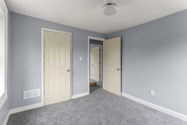 13437 E State Fair St, Detroit, MI 48205 - unfurnished bedroom featuring carpet and baseboards