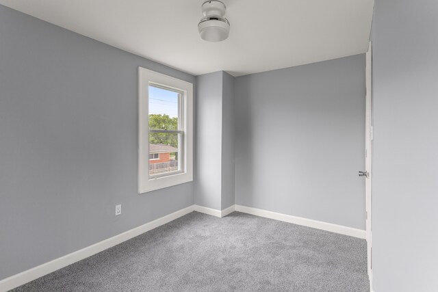 13437 E State Fair St, Detroit, MI 48205 - carpeted empty room featuring baseboards