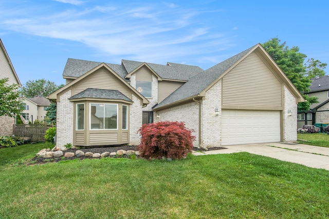 view of front of house featuring a garage and a front lawn