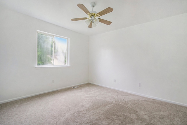 carpeted empty room with ceiling fan