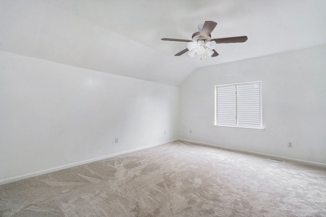 unfurnished room with carpet flooring, ceiling fan, and lofted ceiling