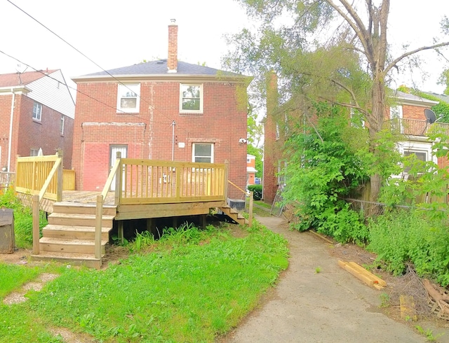 back of property featuring a deck