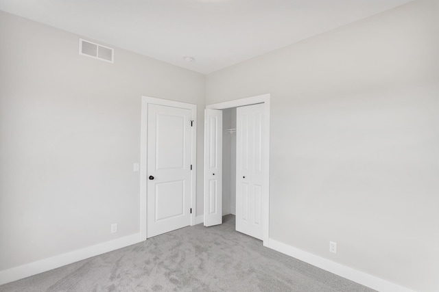9139 Perry Ct, Zeeland, MI 49464 - unfurnished bedroom featuring carpet floors, baseboards, and a closet