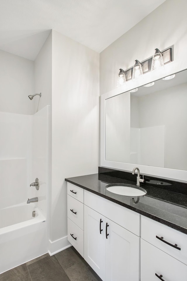 9139 Perry Ct, Zeeland, MI 49464 - bathroom featuring vanity, bathtub / shower combination, and baseboards