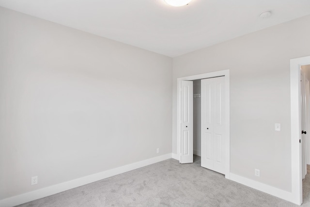 9139 Perry Ct, Zeeland, MI 49464 - unfurnished bedroom featuring carpet floors, baseboards, and a closet