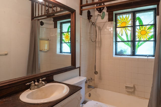 full bathroom featuring shower / bath combination with curtain, toilet, and vanity