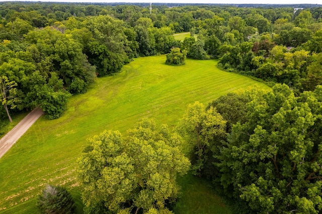 birds eye view of property with a rural view