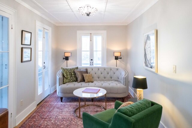 living room with french doors and an inviting chandelier